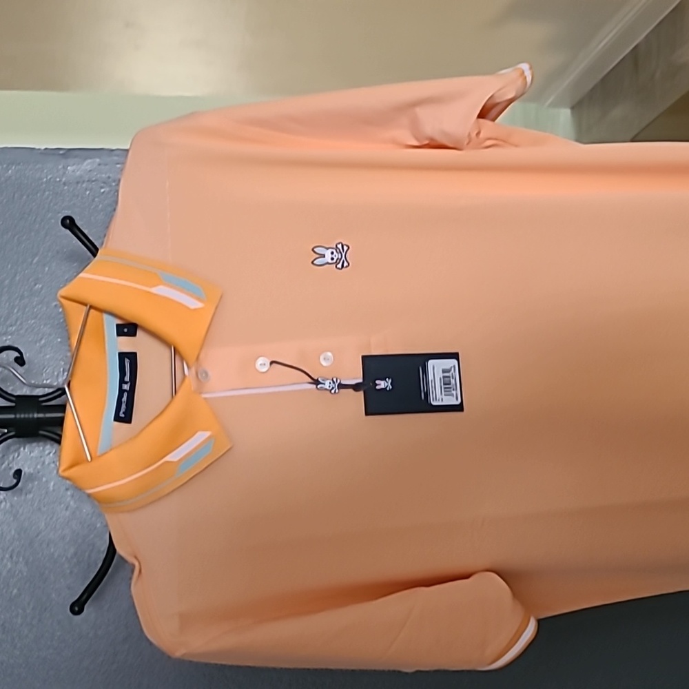 Psycho Bunny sport polo Size xtra small orange soda color